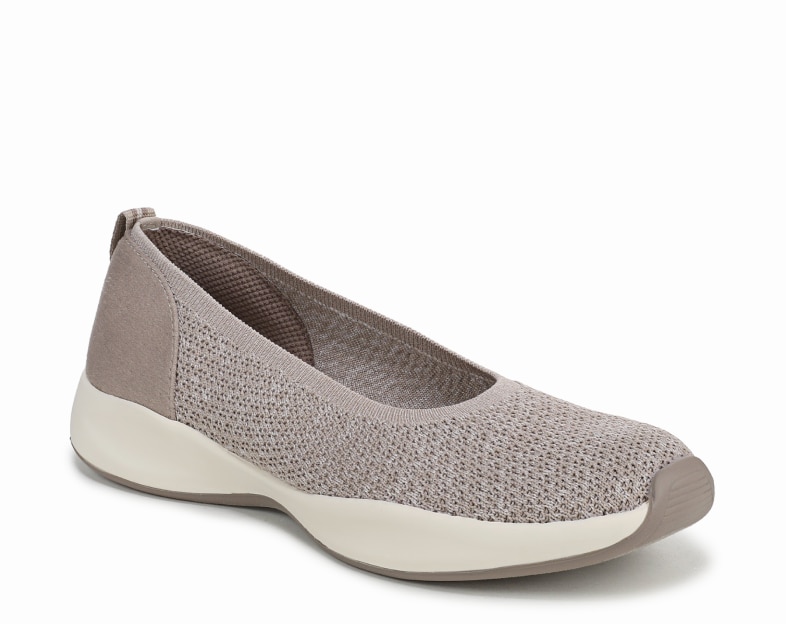An angled view of a taupe fabric slip on shoe with an off-white sole. 