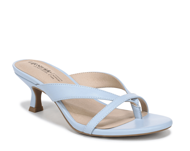 An angled view of a strappy heeled sandal in light blue. 