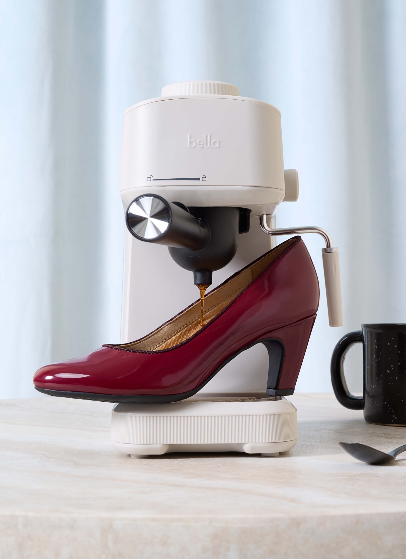 The new Parigi Plus pump heel in the color dark cherry red, sitting on a sewing machine.