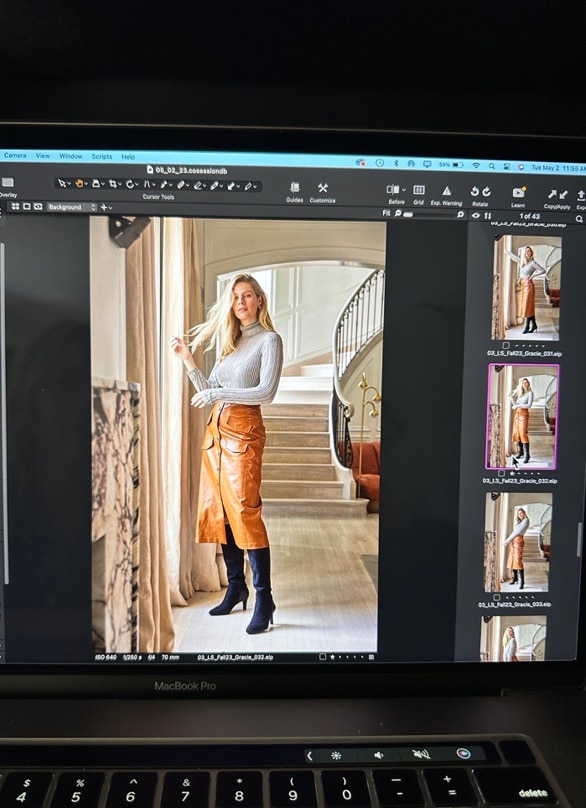 Preview images on a laptop of a model wearing the LifeStride Gracie tall boot in black in front of stairs.