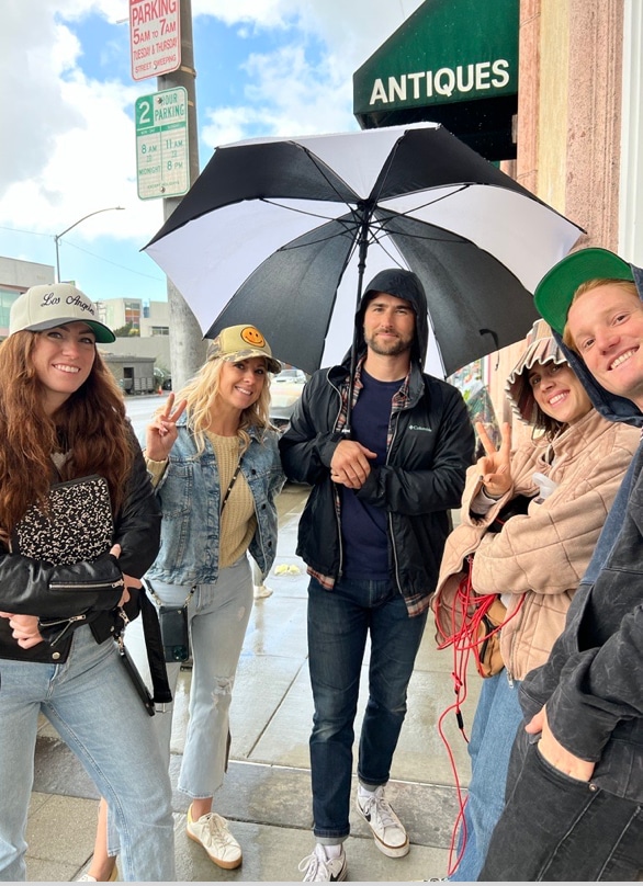 A group of five crew members pose on the streets of Los Angeles.