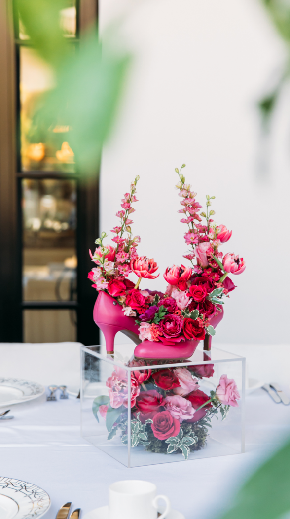 A hot pink floral arrangement looks stunning inside the Parigi pump in raspberry pink.