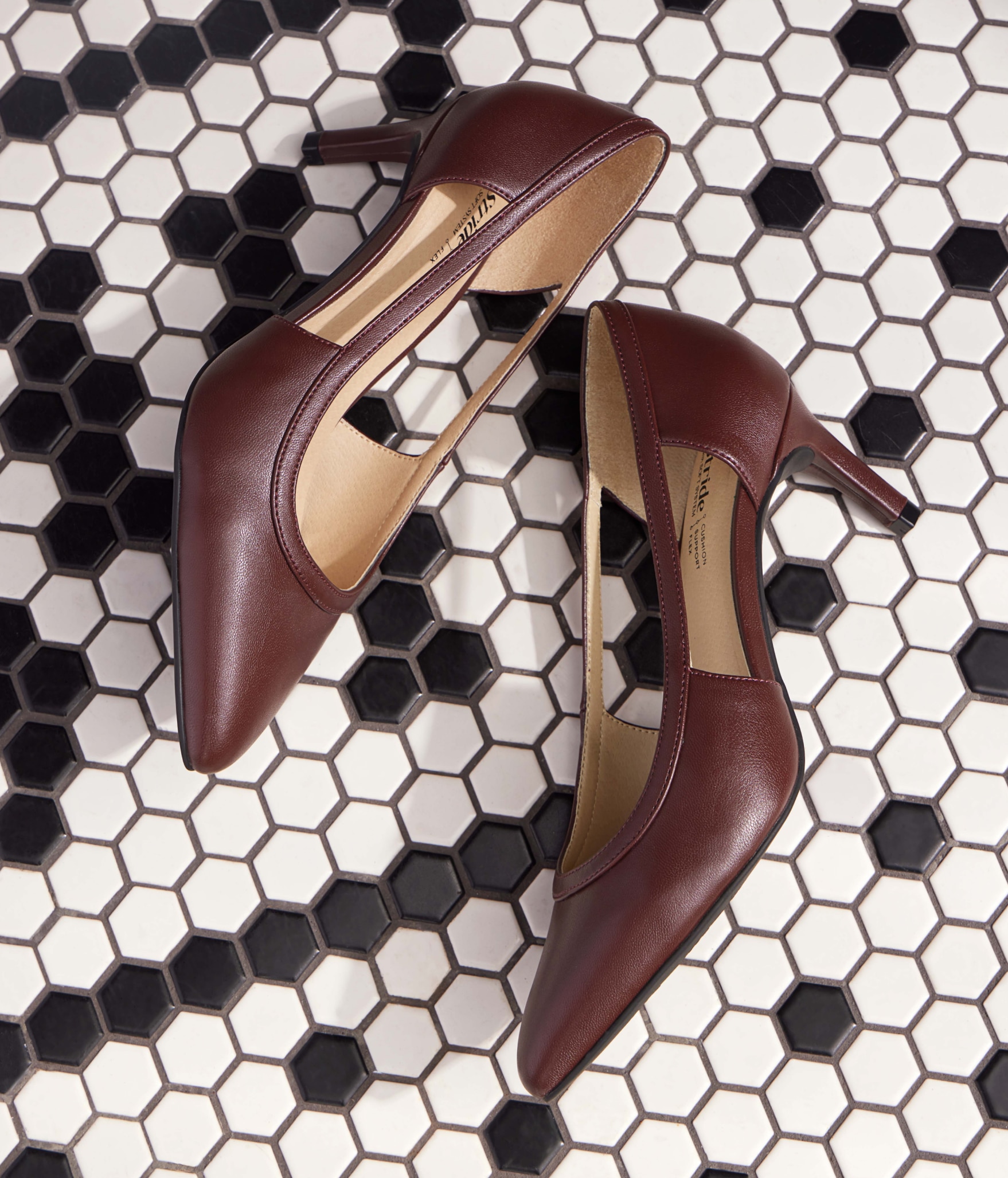 a pair of LifeStride heels on a black and white tile floor