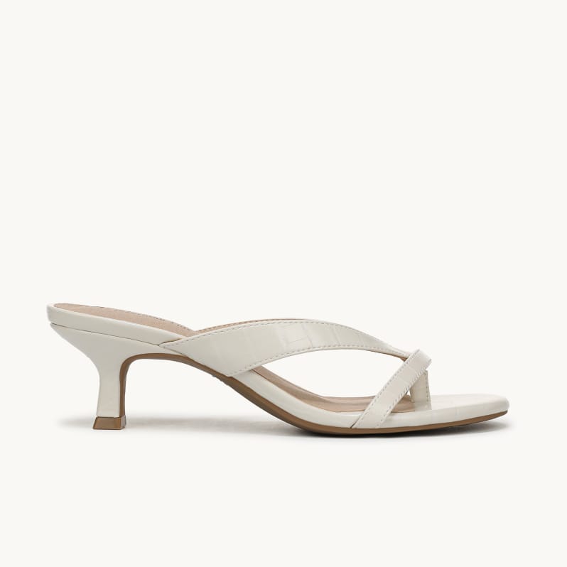 Side view of a women's thong sandal heel in Bone White Croco Faux Leather.