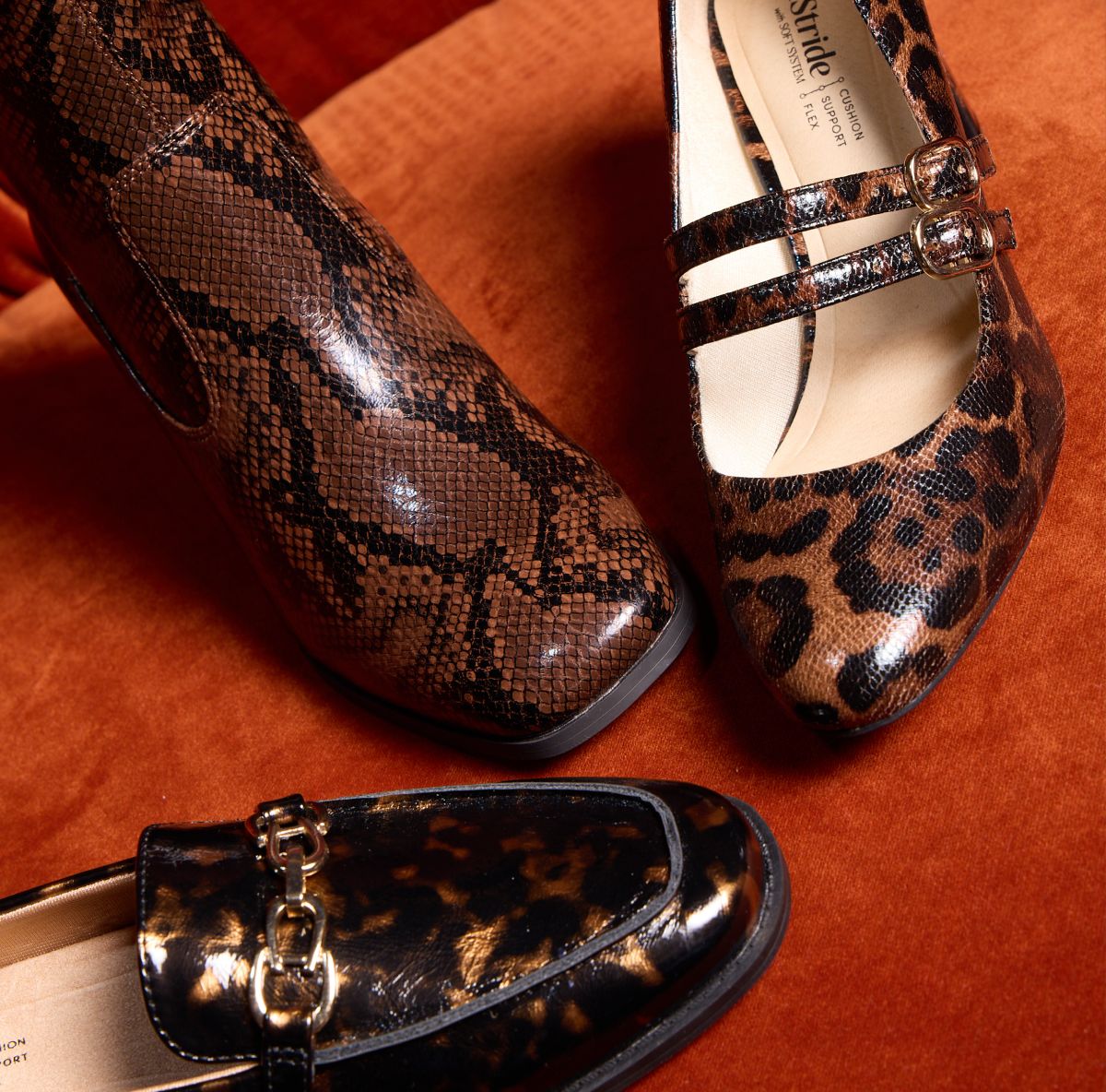 Three women's shoes in various animal prints on a red background.