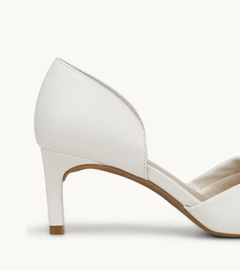 A partial side view of a white pump heel. 
